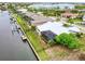 A waterfront home with a pool, lanai, and dock on a beautiful canal at 2160 Aqui Esta Dr, Punta Gorda, FL 33950