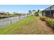 Fenced backyard with view of the canal and waterfront neighborhood at 2160 Aqui Esta Dr, Punta Gorda, FL 33950