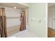Bathroom featuring neutral tiling, shower stall with brown curtain, and grab bar at 2160 Aqui Esta Dr, Punta Gorda, FL 33950