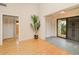 Bright entryway with wood floors, ample closet space, and decorative security door at 2160 Aqui Esta Dr, Punta Gorda, FL 33950