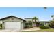 Charming home with an attached two-car garage and mature landscaping at 2160 Aqui Esta Dr, Punta Gorda, FL 33950
