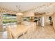 Bright eat-in kitchen features stainless steel appliances, tile floors, and a large window with water views at 2160 Aqui Esta Dr, Punta Gorda, FL 33950