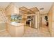 Eat-in kitchen with stainless steel appliances and plentiful cabinets with a view to the pool at 2160 Aqui Esta Dr, Punta Gorda, FL 33950