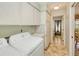Laundry room with upper storage cabinets, and modern washer and dryer at 2160 Aqui Esta Dr, Punta Gorda, FL 33950
