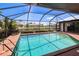 Beautiful in-ground pool with brick surround, offering a refreshing escape and scenic backyard views at 2160 Aqui Esta Dr, Punta Gorda, FL 33950