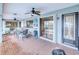 Covered pool patio with ceiling fans and comfortable lounge seating for outdoor entertaining and relaxation at 2160 Aqui Esta Dr, Punta Gorda, FL 33950