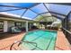 Enclosed pool area with covered seating and bar area at 2160 Aqui Esta Dr, Punta Gorda, FL 33950
