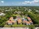 Aerial view of a community, featuring lush trees, manicured lawns, ample parking, and comfortable housing at 22481 Westchester Blvd # B48, Punta Gorda, FL 33980