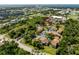 Aerial community shot with lush greenery, sidewalks, parking, and well-maintained buildings at 22481 Westchester Blvd # B48, Punta Gorda, FL 33980