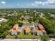 Aerial view of a community, featuring lush trees, manicured lawns, ample parking, and comfortable housing at 22481 Westchester Blvd # B48, Punta Gorda, FL 33980