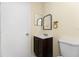Bathroom featuring a vanity with dark wood cabinets, toilet, and neutral paint at 22481 Westchester Blvd # B48, Punta Gorda, FL 33980