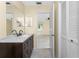 Bathroom featuring a spacious vanity and a view into a spacious bedroom at 22481 Westchester Blvd # B48, Punta Gorda, FL 33980