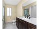 Bathroom featuring a modern vanity, toilet and shower with glass doors at 22481 Westchester Blvd # B48, Punta Gorda, FL 33980