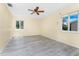 Bright bedroom featuring sleek flooring, natural light, and a modern ceiling fan at 22481 Westchester Blvd # B48, Punta Gorda, FL 33980