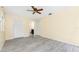 Spacious bedroom features sleek floors and a door that leads to a bathroom at 22481 Westchester Blvd # B48, Punta Gorda, FL 33980