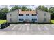 Charming condo building exterior features a well-maintained facade and ample parking spaces at 22481 Westchester Blvd # B48, Punta Gorda, FL 33980