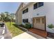 Close-up of the condo's entry showcases a well-kept lawn and a brick-paved entry at 22481 Westchester Blvd # B48, Punta Gorda, FL 33980