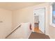 Hallway view highlights a fire extinguisher and an inviting open doorway to unit 48 at 22481 Westchester Blvd # B48, Punta Gorda, FL 33980