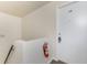 Bright hallway features a fire extinguisher and entry door number 48, ensuring safety and accessibility at 22481 Westchester Blvd # B48, Punta Gorda, FL 33980
