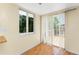The kitchen area features light walls and floors and a sliding glass door to a balcony at 22481 Westchester Blvd # B48, Punta Gorda, FL 33980