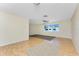 Large living area offers hardwood floors, neutral paint, and a great layout for flexible living at 22481 Westchester Blvd # B48, Punta Gorda, FL 33980