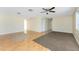 Open living area with hardwood floors, a ceiling fan, and lots of space to relax and entertain at 22481 Westchester Blvd # B48, Punta Gorda, FL 33980