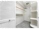 Organized walk-in closet provides ample storage space with shelving and hanging rods at 22481 Westchester Blvd # B48, Punta Gorda, FL 33980
