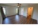 Bright bedroom featuring hardwood floors, large windows, and ensuite bathroom at 23273 Abeline Ave, Punta Gorda, FL 33980