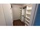 Walk-in closet with custom built-in shelving for ample storage space at 23273 Abeline Ave, Punta Gorda, FL 33980