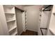 Walk-in closet with custom built-in shelving and dual clothing rods at 23273 Abeline Ave, Punta Gorda, FL 33980