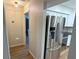 Open kitchen area with stainless steel appliances and white cabinets at 23273 Abeline Ave, Punta Gorda, FL 33980