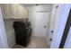 Laundry room featuring cabinetry above the washer and dryer at 23273 Abeline Ave, Punta Gorda, FL 33980
