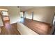 Open living space features wood-look floors, vaulted ceiling, and neutral paint at 23273 Abeline Ave, Punta Gorda, FL 33980