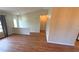 Bright living area features wood-look flooring, neutral paint, and natural light at 23273 Abeline Ave, Punta Gorda, FL 33980