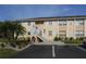 Charming multi-Gathering home featuring a neatly landscaped yard and designated guest parking spaces at 25050 Sandhill Blvd # A2, Punta Gorda, FL 33983