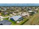 Picturesque aerial scene displays the home's screened-in pool and the beautiful lake of the surrounding neighborhood at 25371 Paladin Ln, Punta Gorda, FL 33983