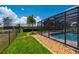 Well-maintained backyard with a refreshing pool, beautiful landscaping and fencing at 25371 Paladin Ln, Punta Gorda, FL 33983
