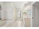 Bright bathroom featuring a bathtub, double vanity, and a window at 25371 Paladin Ln, Punta Gorda, FL 33983