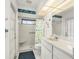 Bathroom featuring walk-in shower and decorated with aquatic themed accents at 25371 Paladin Ln, Punta Gorda, FL 33983