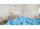 Bright bedroom with a ceiling fan, closet, and light colored floors at 25371 Paladin Ln, Punta Gorda, FL 33983