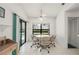Dining area features a table with views of the pool and sliding glass doors at 25371 Paladin Ln, Punta Gorda, FL 33983