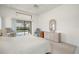 Main bedroom boasts a ceiling fan, slider to patio, and a dresser at 25371 Paladin Ln, Punta Gorda, FL 33983