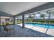 Inviting screened in pool with mature palm trees at 25371 Paladin Ln, Punta Gorda, FL 33983