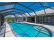 Enclosed pool with clear blue water, providing a private and enjoyable swimming experience at 25371 Paladin Ln, Punta Gorda, FL 33983
