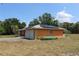 The exterior features a two-car garage, solar panels, and ample room for storing recreational equipment at 28024 Cleveland Ave, Punta Gorda, FL 33982