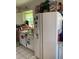 Bright kitchen with white cabinets, appliances, and a window above the sink at 28024 Cleveland Ave, Punta Gorda, FL 33982