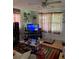 Cozy living room with a TV, lots of decorations, and great natural light at 28024 Cleveland Ave, Punta Gorda, FL 33982
