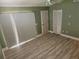 Inviting bedroom featuring wood flooring, lots of natural light and a modern ceiling fan at 3300 Loveland Blvd # 602, Punta Gorda, FL 33980