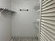Well-organized walk-in closet featuring wire shelving for optimal storage at 3300 Loveland Blvd # 602, Punta Gorda, FL 33980