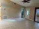 Open-concept living room with neutral walls, tile flooring, and natural light streaming in at 3300 Loveland Blvd # 602, Punta Gorda, FL 33980